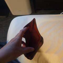 コ－チの二つ折の財布の画像