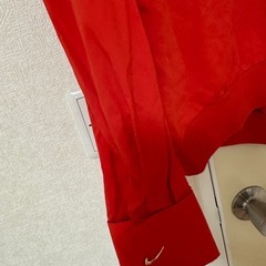NIKEオレンジ色パーカーの画像