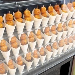 お祭り屋台で元気にお仕事の画像