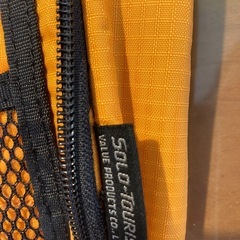 ショルダーバッグ　パスポート入れ　海外旅行　オレンジ　ソロツーリストの画像