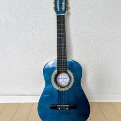 トルコブルーのアコースティックギターの画像