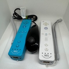 Wii本体+リモコン2+ヌンチャク1+マリオカートハンドル2+ソフト7本の画像
