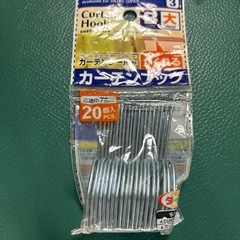 掃除機ノズルブラシと、カーテンフックの画像