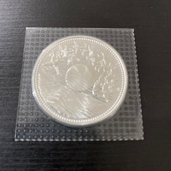 天皇陛下御在位60年10,000円銀貨幣の画像