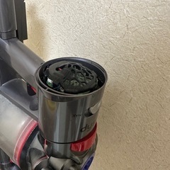 ダイソン掃除機と立てかけ台のセットの画像