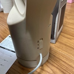 羽根なし 猫 ファンヒーターの画像