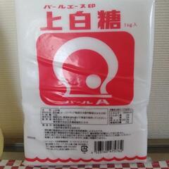 サラダ油2本と砂糖の画像