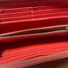 COACH長財布 オレンジ💓‪ ラウンドジップレザー シリアルナンバーありの画像