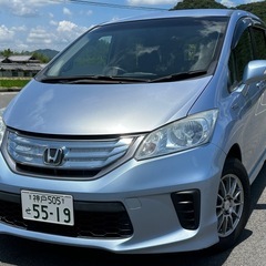 【商談中】《平成23年12月登録 フリード ハイブリッド☆車検超ロング令和8年12月まで！》☆【装備充実ジャストセレクション】☆両側パワースライドドア☆スマートキーX2個☆Hondaインターナビ☆バックモニター☆クルーズコントロール☆VSA☆ホンダディーラー管理車両につき機関◎の画像