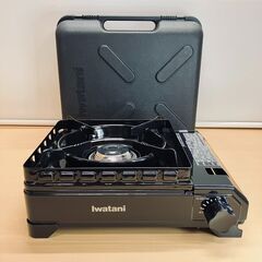 イワタニ カセットフー タフまる カセットこんろ CB-ODX-1（ブラック）風に強くアウトドアに最適！キャリングケース付きの画像