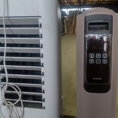 掃除機、オイルヒーター、水入れて冷やす扇風機の画像