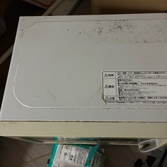 電子レンジと座椅子の画像