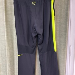 NIKEナイキ ボトムス ボトムス ウーブンPT サイドライン トラックパンツの画像