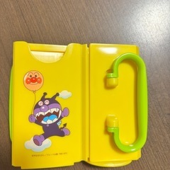 アンパンマン 紙パックホルダー (ハンドル付き) イエローの画像