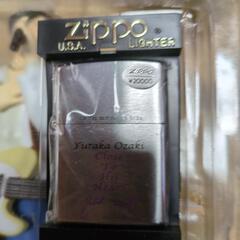 尾崎豊のフィギュアと ZIPPO ライターのセットの画像