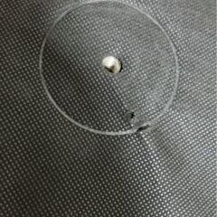 グレー ソファベッド ボタン付きクッションの画像