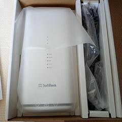 食品、DVD、紙袋、レジ袋たくさん、SoftBankAir機器の画像