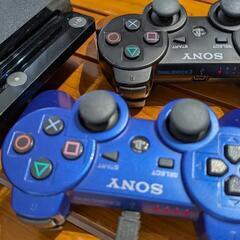 PS3本体とコントローラー2個のセットの画像