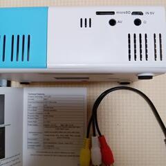 ポータブルミニHDプロジェクター 内蔵スピーカー付き 1080PフルHD対応 リモコン付属 LEDプロジェクターの画像