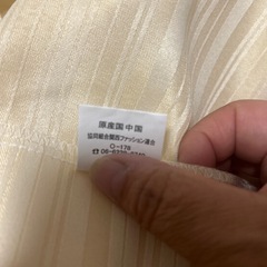 ベージュ色のカーテン（135cm）の画像