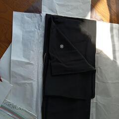 未使用の帯と冬用の喪服。の画像