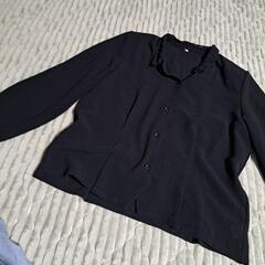 レディース黒のトップスの画像