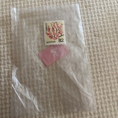 入れ物と82円切手の画像