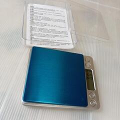 新品未使用です・料理用軽量計液晶でグラム数測れます、サイズ横幅1.5cm,縦幅12.5cm,本体厚さ２cm,青色の液晶でグラム数測れます。の画像