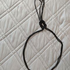 黒色のネックレスです。の画像