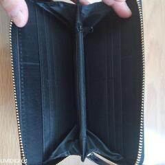 新品、未使用！黒のエナメル長財布の画像