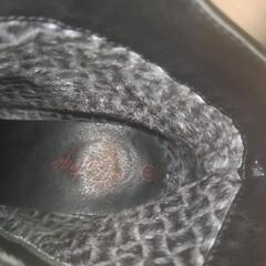 高ヒールの黒いブーツの画像