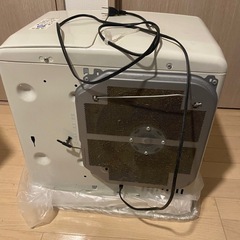 灯油ストーブと灯油タンク18リットルとポンプの画像