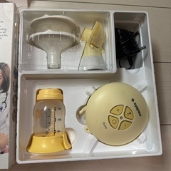 Medela母乳搾乳器 イエロー 付属品付きの画像