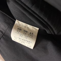 男性用スーツ上下セット（サイズ表記あり）の画像