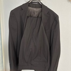 スーツ　黒の画像
