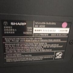 52インチのテレビとサラウンドシステムセットの画像