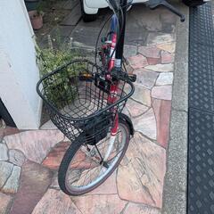 赤のVolkwsgen折りたたみ自転車の画像