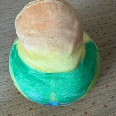 オウムの顔 クッションの画像