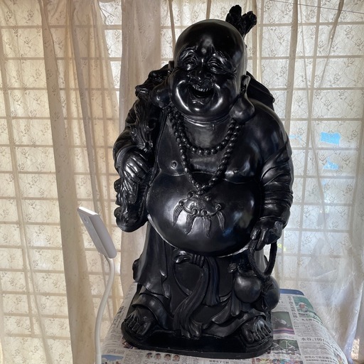 黄貴袋をもってる。優しい笑顔の福神様