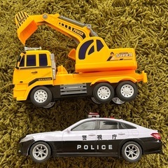 ショベルカーとパトカーの画像