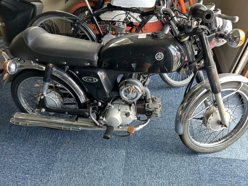 YB−1