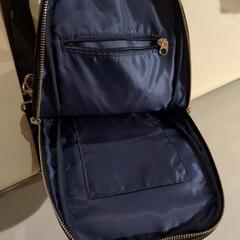 黒とベージュのショルダーバッグの画像