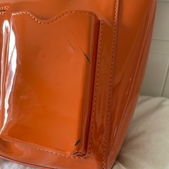 アコモデ ACCOMMODE ミニマルパテントバッグ オレンジの画像