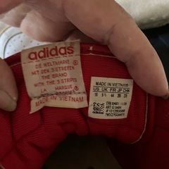 adidas FORUM MID（アディダス フォーラム ミッド）」型番G19484で、ホワイトとレッドのハイカットスニーカーですの画像
