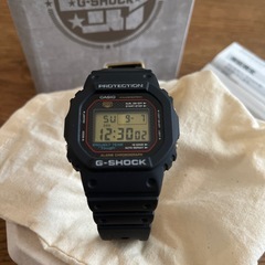 CASIO メンズ腕時計 -- G-SHOCK 40th Anniversary RECRYSTALLIZED CASIO -- 黒 ブラック 金 ゴールド DW-5040PGの画像