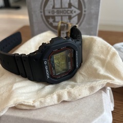 CASIO メンズ腕時計 -- G-SHOCK 40th Anniversary RECRYSTALLIZED CASIO -- 黒 ブラック 金 ゴールド DW-5040PGの画像