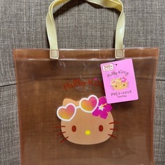 日焼けキティちゃん クリアバックとチャーム水色の画像