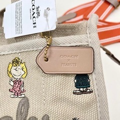 コーチ PEANUTS スヌーピー カーゴ ハンドバッグ レディース の画像