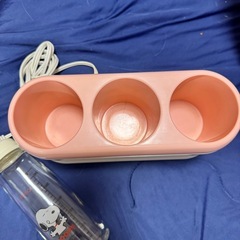 哺乳瓶とウォーマーの画像