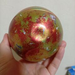 無料　缶　ケース　恐竜の卵？の画像